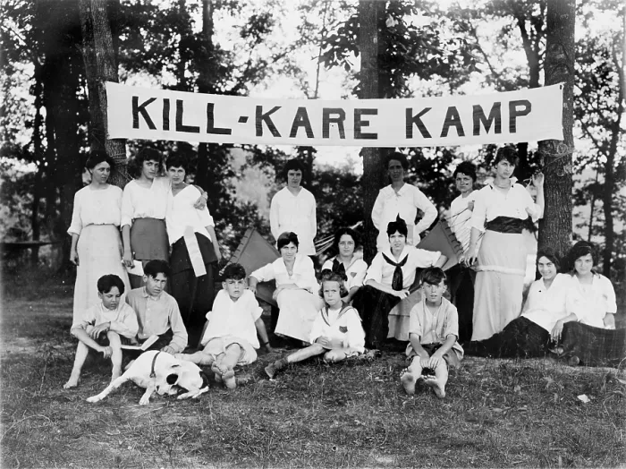 Framed Print : Kill-Kare Kamp, boys and girls posed beneath a camp banner, photograph circa 1909-1932