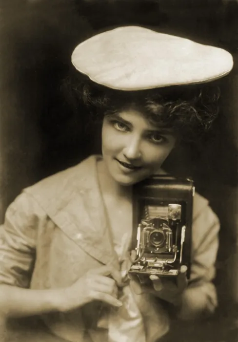 Framed Print : THE KODAK GIRL, a pretty girl posed with camera in a 1909 Kodak advertisement Framed Print : THE KODAK GIRL, a pretty girl posed with camera in a 1909 Kodak advertisement