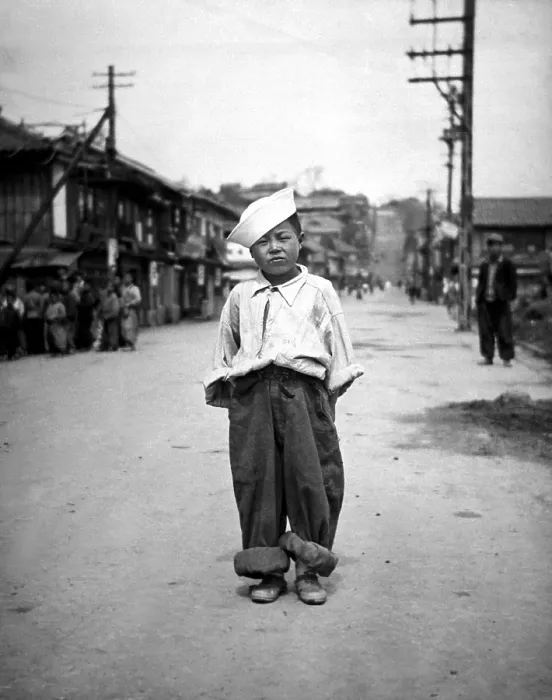 Framed Print : A Korean orphan boy adopted by a motor pool battalion at Inchon, Korea. Called Number One by the soldiers who nursed him back to health. Korean War, 1950-53