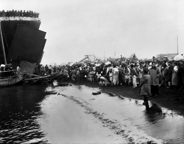 Framed Print : Korean refugees prepare to board an LST during the evacuation of Hungnam. They are fleeing the North Korean / Chinese troops approaching as the UN troops withdraw to South Korea Framed Print : Korean refugees prepare to board an LST during the evacuation of Hungnam. They are fleeing the North Korean / Chinese troops approaching as the UN troops withdraw to South Korea