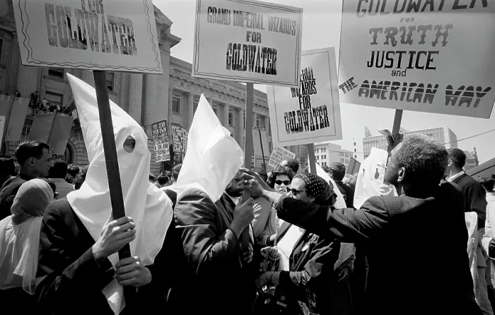Framed Print : Ku Klux Klan members supporting Barry Goldwater's campaign for the presidential nomination at the Republican National Convention. An African American man pushes back