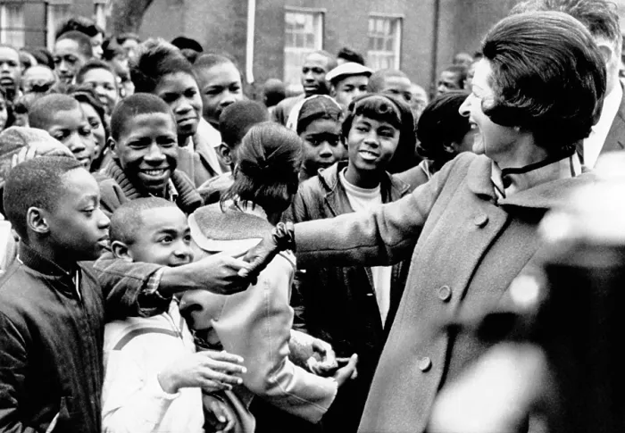 Framed Print : Lady Bird Johnson greets African American students in Washington, DC. She visited the school complex for over 3, 000 students to dedicate the new landscaping