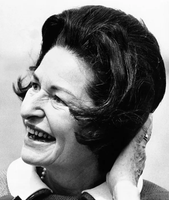 Framed Print : Lady Bird Johnson smiles as the wind disrupts her hairdo. She was visiting the Statue of Liberty to dedicate the American Museum of Immigration