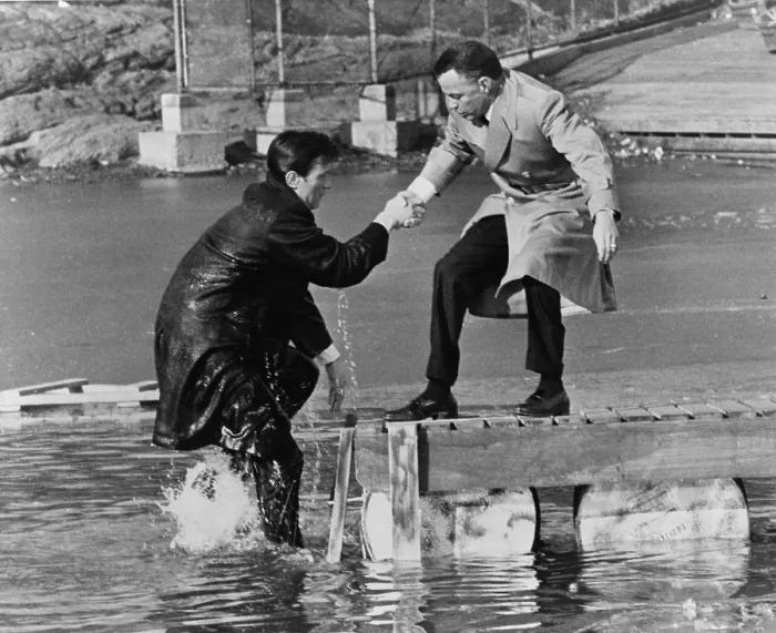 Framed Print : Laurence Harvey and Frank Sinatra doing a scene for the, THE MANCHURIAN CANDIDATE in Central Park, in which Harvey just walked off the pier. 1962 Framed Print : Laurence Harvey and Frank Sinatra doing a scene for the, THE MANCHURIAN CANDIDATE in Central Park, in which Harvey just walked off the pier. 1962