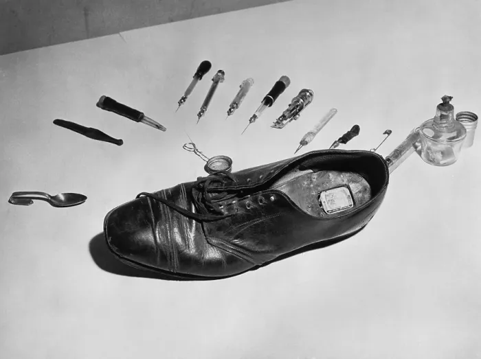 Framed Print : Law enforcement photo of a shoe with metal box in cut out section of heel used to smuggle drugs into a detention facility