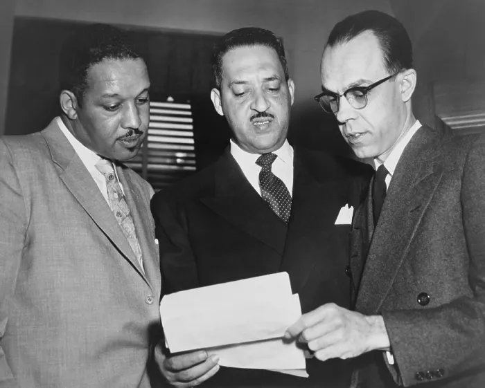 Framed Print : Lawyers confer at the Supreme Court prior to presenting arguments against school segregation