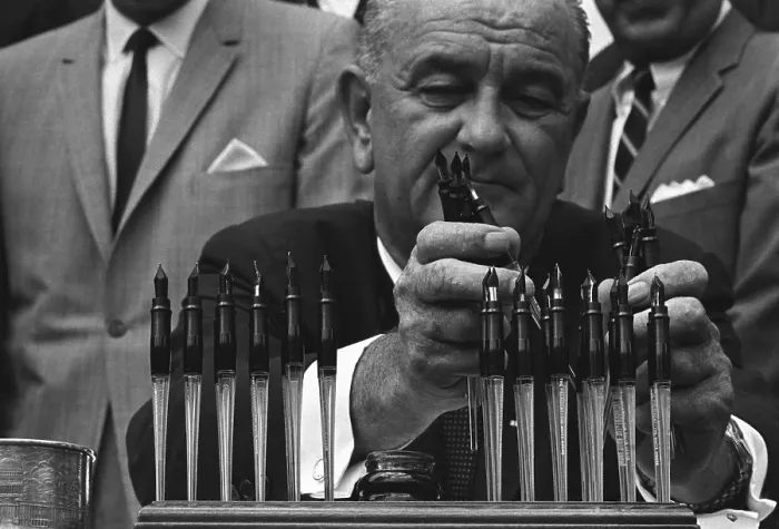 Framed Print : LBJ's Great Society programs. President Lyndon Johnson with the many pens he will use to sign the Housing and Urban Development Act of 1965 Framed Print : LBJ's Great Society programs. President Lyndon Johnson with the many pens he will use to sign the Housing and Urban Development Act of 1965