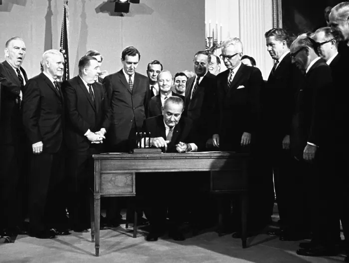 Framed Print : LBJ's Great Society programs. President Lyndon Johnson signing the Clean Air Act. Others present include Sec. Arthur Goldberg, Sen. Edmund Muskie, Sen