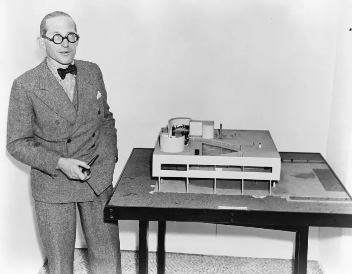 Framed Print : Le Corbusier (1887-1965), with an architectural model of his Villa Savoye, which was built at Poissy, France (1929-31). 1935 photo