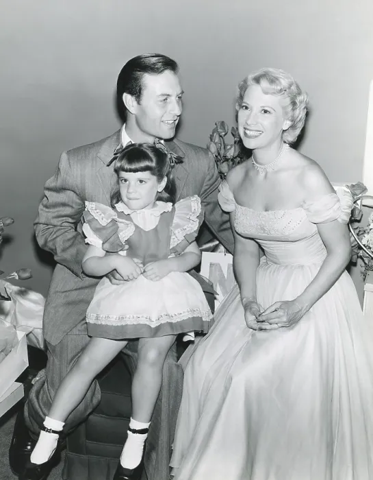 Framed Print : From left: George Montgomery, daughter Melissa Montgomery, wife Dinah Shore, July 1, 1953