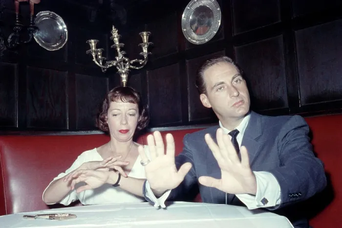 Framed Print : From left: Imogene Coca, Sid Caesar, sitting at banquette, ca. 1950s