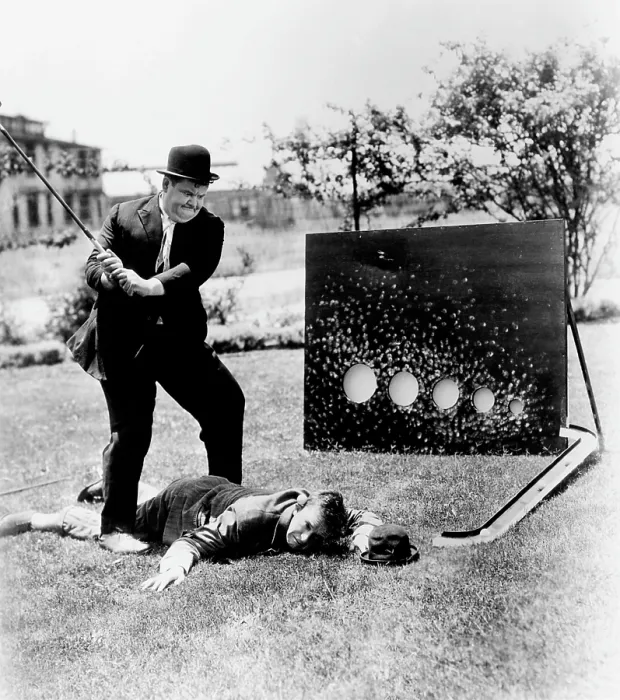 Framed Print : From left, Oliver Hardy, Stan Laurel, brushing up on their golf game, ca. 1930s