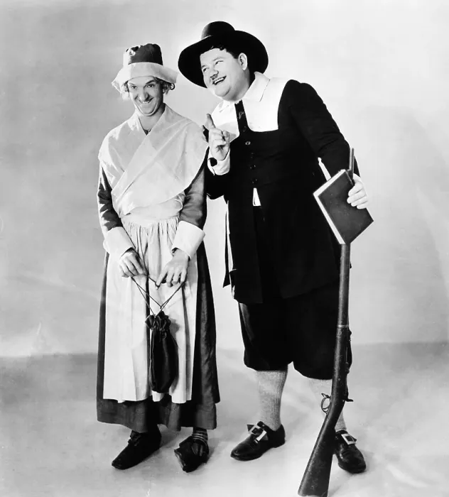 Framed Print : From left: Stan Laurel and Oliver Hardy in a Thanksgiving-themed MGM publicity shot, early 1930s