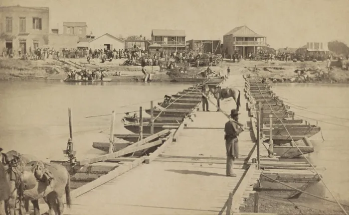 Framed Print : Levee Street in Brownsville, Texas, viewed from the US Army pontoon bridge across the Rio Grande River at Matamoros, Mexico, in November of 1866