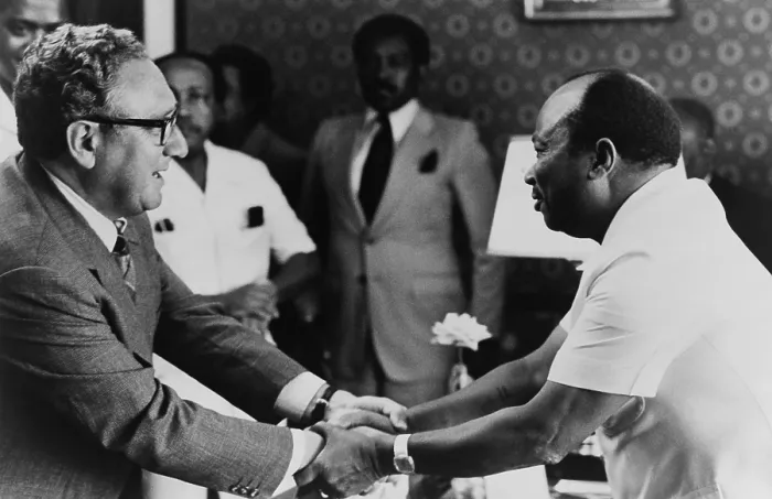 Framed Print : Liberian President William Tolbert Jr. and Henry Kissinger clasp hands. ?May 1, 1976. Kissinger was on a 7 nation tour of African from April 24-May 5, 1976. (BSLOC_2015_14_51)