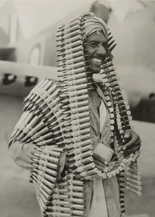 Framed Print : Libyan Arab assistant in the Royal Air Force carries ammunition for a Kittyhawk fighter. Ca. 1940-42, during World War 2. (BSLOC_2013-12_64)