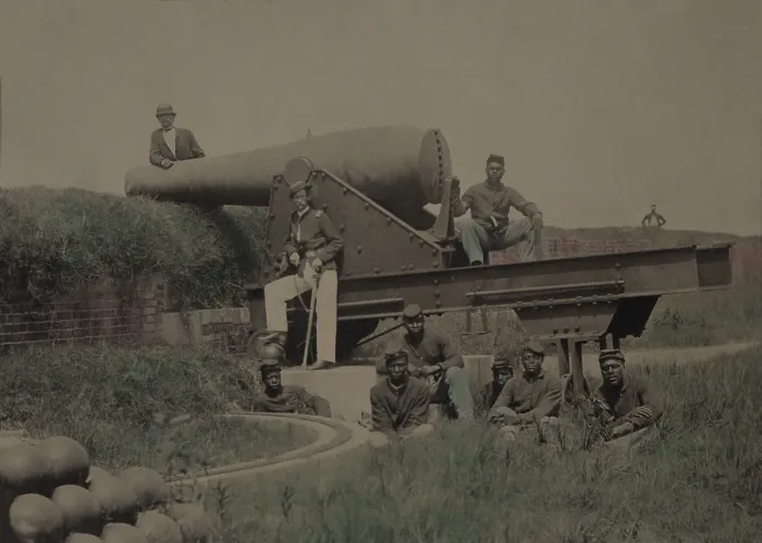 Framed Print : Lieutenant Samuel K. Thompson, Company C, 54th U.S. Colored Troops Infantry Regiment, posed with a 10 inch Rodman cannon