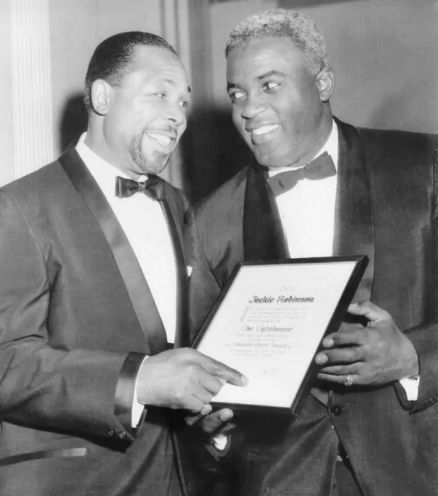 Framed Print : Light heavyweight champion Archie Moore talks with ex-baseball star Jackie Robinson (right).They were at the Lighthouse Sports World Dinner