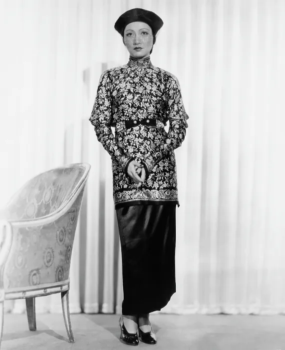 Framed Print : LIMEHOUSE BLUES, (aka EAST END CHANT), Anna May Wong, in a printed-silk tunic and satin skirt and turban, 1934 Framed Print : LIMEHOUSE BLUES, (aka EAST END CHANT), Anna May Wong, in a printed-silk tunic and satin skirt and turban, 1934