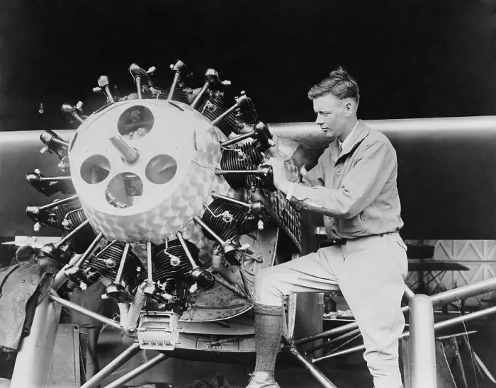 Framed Print : Lindbergh examining the cylinders of the Spirit of St. Louis before his Transatlantic Flight, May 1927 (BSLOC_2020_2_69)