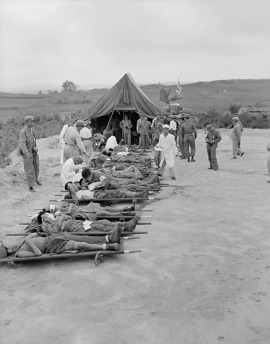 Framed Print : Litter cases of North Korean War POWs are exchanged during Operation Little Switch. They are at the Communist receiving center at Panmunjom, Korea. April-May, 1953