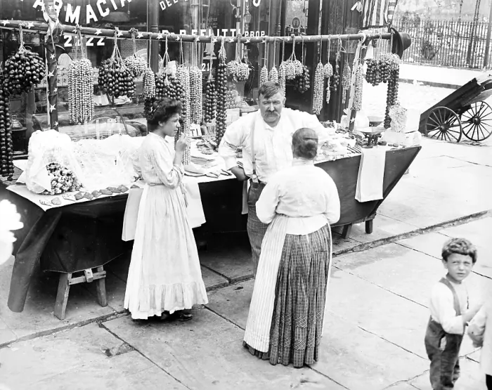 Framed Print : Little Italy - vendor with wares displayed during a festival, New York, ca. 1930s