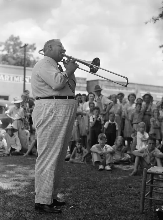 Framed Print : A Local band leader leads with An Old Southern Melody and everybody cheered, home guard passes through Enterprise, Coffee County, Alabama, photograph by John Collier