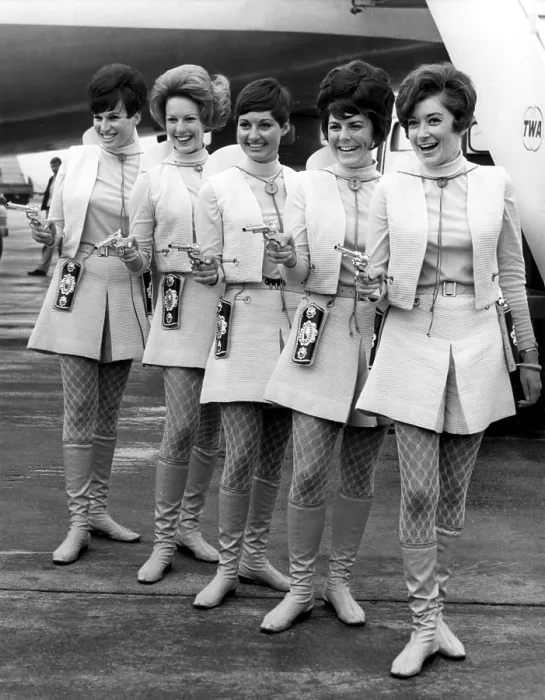 Framed Print : LONDON: These Western Air Lines hostesses are packing pisotls for a reason