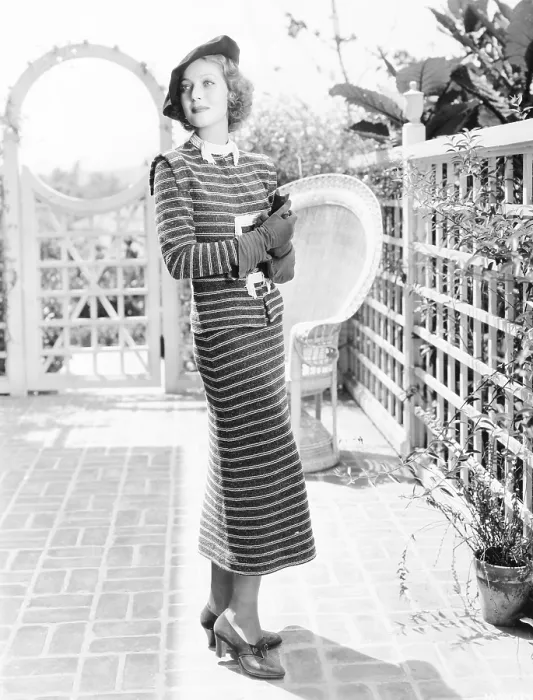 Framed Print : Loretta Young in dark blue and white striped dress covered by a soft and silvery fuzz, ca. 1936