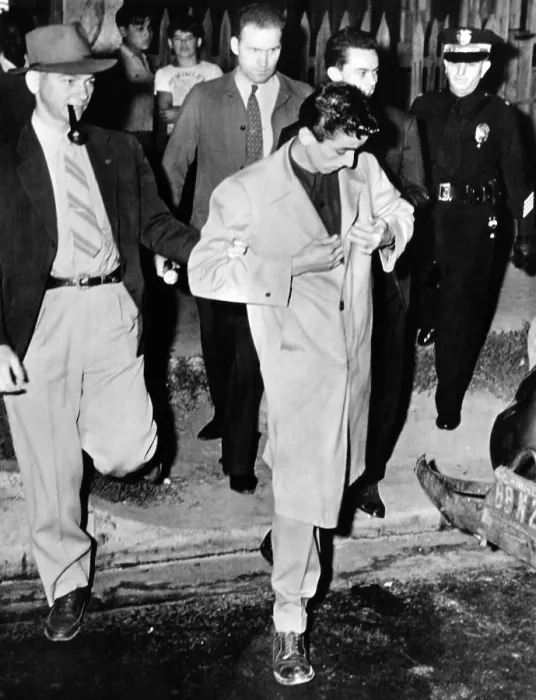 Framed Print : Los Angeles police take a Zoot Suiter into custody. Man wearing a super-knee length zoot suit with stuff cuffs on the drape shaped trousers. June 10, 1943