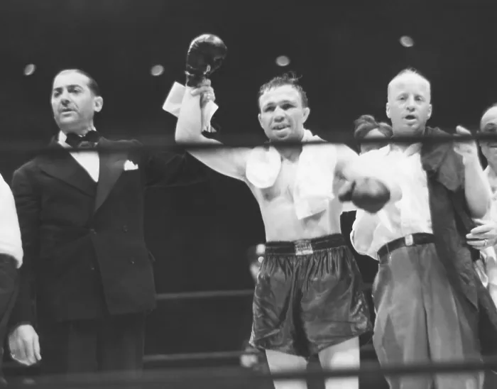 Framed Print : Lou Ambers, World Lightweight Champion, in triumph with Announcer Harry Balough, Aug. 22, 1939