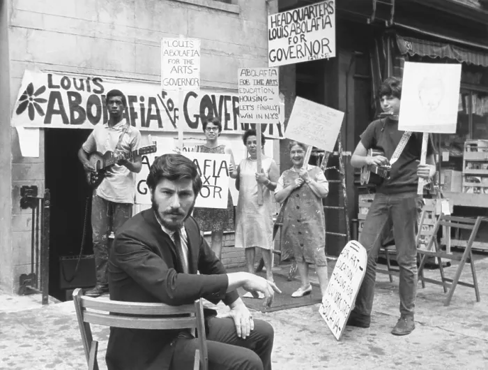 Framed Print : Louis Abolafia, an artist sought a complete rebirth of the arts by running for governor New York. August 16, 1966. Behind him are his supporters and their campaign signs