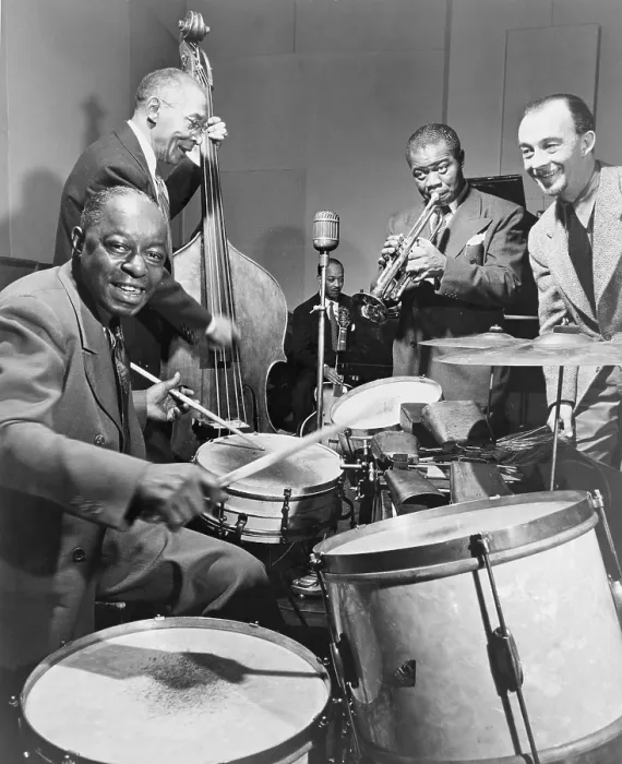 Framed Print : Louis Armstrong (1901-1971), playing trumpet with others during a 1947 broadcast of 'This is Jazz' radio show, directed by Rudi Blesh (far right)