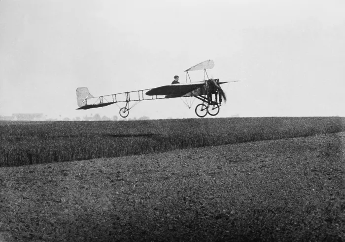 Framed Print : Louis Bleriot 1872-1936 in flight over a field on May 5 1909 probably during practice runs for his July 25 1909 37 minute historic first flight across the English Channel from Les