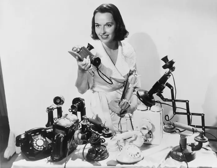 Framed Print : Louise Brooks (1906-1985), popular silent film actress, posing with ten telephones, some old models as well as the most up to date 1936 models Framed Print : Louise Brooks (1906-1985), popular silent film actress, posing with ten telephones, some old models as well as the most up to date 1936 models