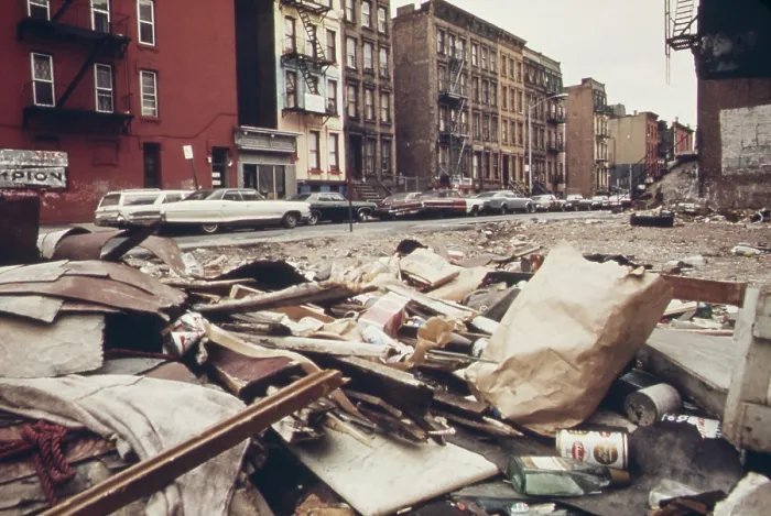 Framed Print : In a low income residential neighborhood in northeast Manhattan an empty lot is strewn with trash at 108th street and Lexington Avenue. Ca. 1973-75 Framed Print : In a low income residential neighborhood in northeast Manhattan an empty lot is strewn with trash at 108th street and Lexington Avenue. Ca. 1973-75
