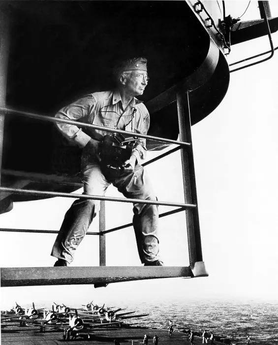 Framed Print : Lt. Commander Edward Steichen (1879-1973) holding camera, standing on aircraft carrier during WWII in 1945