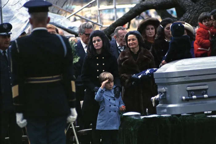 Framed Print : Lyndon Johnson funeral. Lyn Nugent salutes his grandfather's coffin at Johnson Family Cemetery at the LBJ Ranch