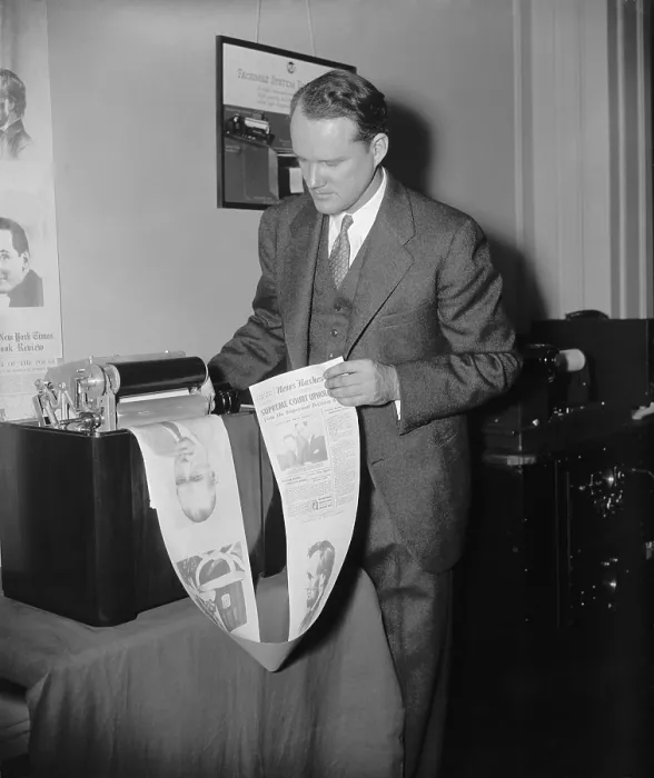 Framed Print : Machine printing out an experimental radio newspaper at the National Association of Broadcasters convention in 1938