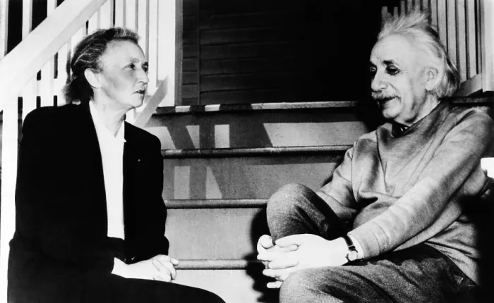 Framed Print : Madame Joliot-Curie and Albert Einstein. The two Nobel Prize winning physicists talk on the steps of Einstein's home in Princeton. March 1948