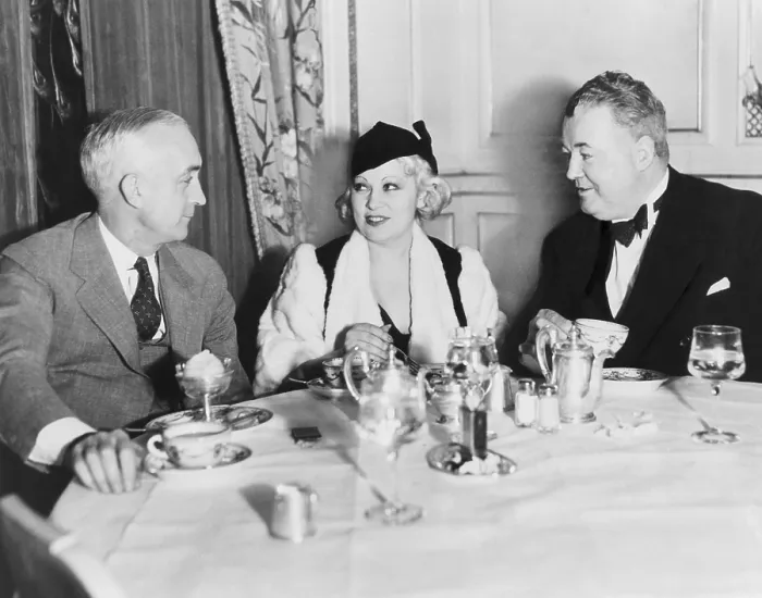 Framed Print : Mae West dining at the Victor Hugo Caf with her manager James Timony (right). At left is John Hammel of New York. 1933. (BSLOC_2013_9_13) Framed Print : Mae West dining at the Victor Hugo Caf with her manager James Timony (right). At left is John Hammel of New York. 1933. (BSLOC_2013_9_13)