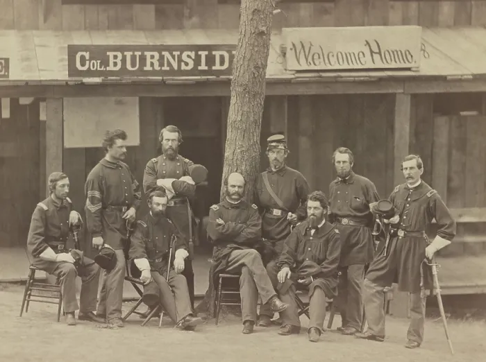 Framed Print : Major General Ambrose Burnside (seated, center) and officers of the 1st Rhode Island Volunteers at Camp Sprague, Rhode Island, 1861. Behind them is a sign reading, Col