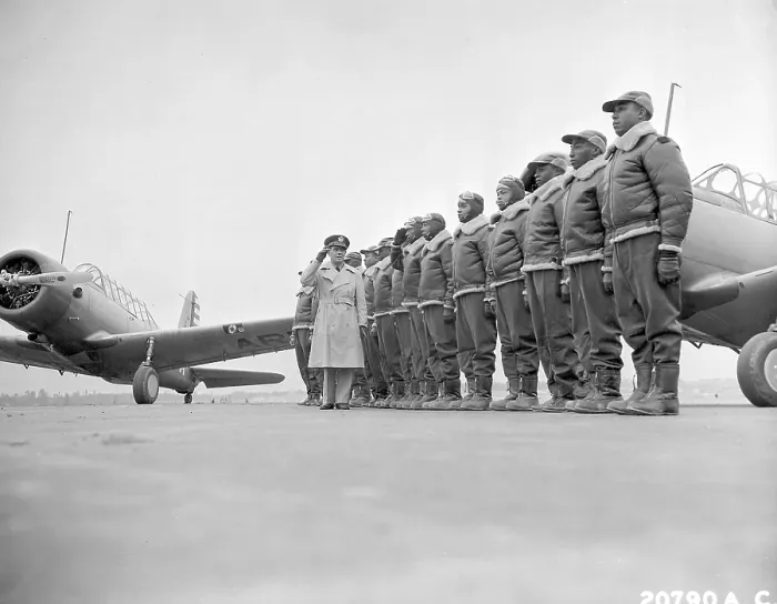 Framed Print : Major James Ellison reviews first class of Tuskegee Airmen, 1941. On left is a Vultee BT-13 trainer aircraft at U.S. Army Air Corps flying school, Tuskegee, Alabama. World War 2
