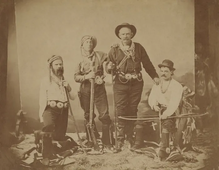 Framed Print : Major John Wesley Powell (left) poses with three unidentified interpreters who accompanied him on exploring expeditions of the western territories after the US Civil War, ca