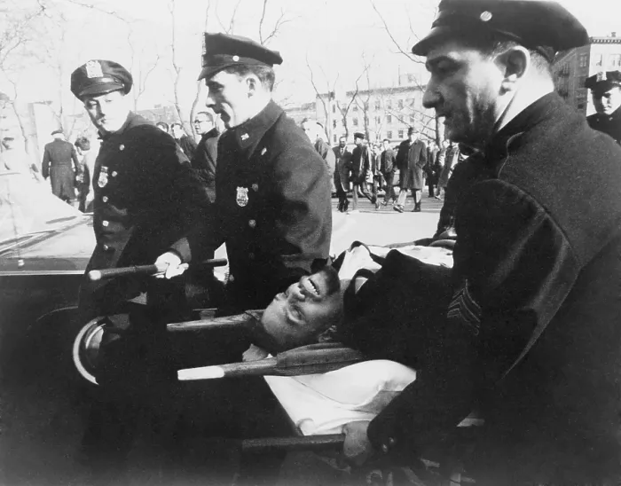 Framed Print : Malcolm X (1925-1965), on stretcher carried by New York policemen following his assassination at rally in a Harlem. February 21, 1965