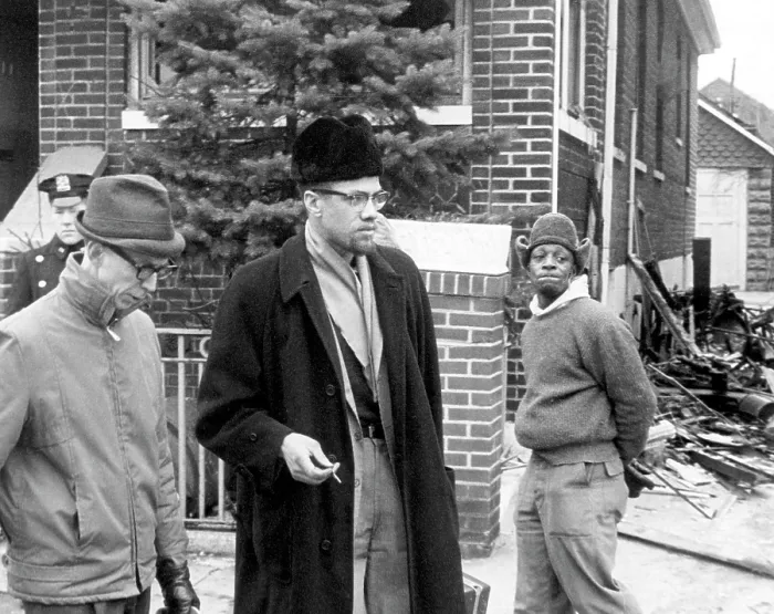 Framed Print : Malcolm X (center, 1925-1965), talks to a reporter after a fire bomb was thrown in his house. February 14, 1965. CSU Archives Courtesy Everett Collection Framed Print : Malcolm X (center, 1925-1965), talks to a reporter after a fire bomb was thrown in his house. February 14, 1965. CSU Archives Courtesy Everett Collection