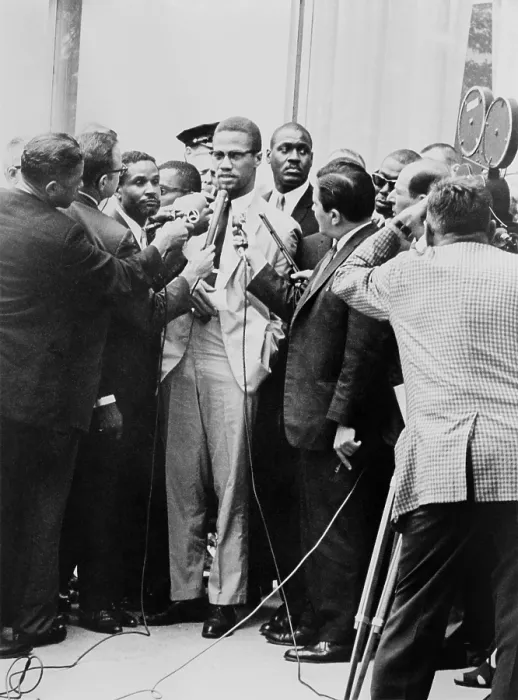 Framed Print : Malcolm X being interviewed by reporters in New York, 1964