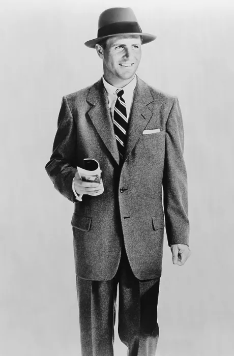 Framed Print : Male model dressed in a wearing single-breasted grey flannel suit and hat representing a businessman. 1953. (BSLOC_2010_18_73)