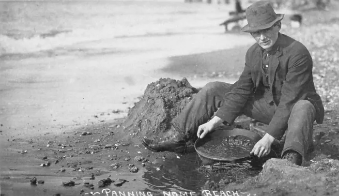Framed Print : Man panning gold on Nome, Alaska beach in the early 20th century