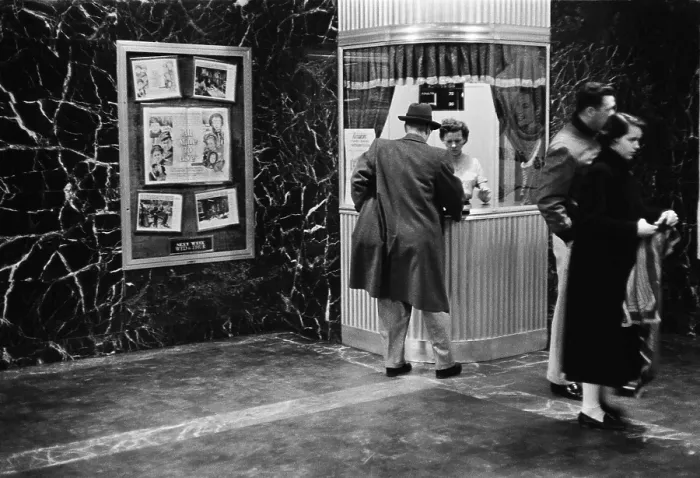 Framed Print : Man purchasing a movie ticket for the film. The coming attraction is the film, ALL MINE TO GIVE. Feb. 9, 1958. - (BSLOC_2015_1_162)